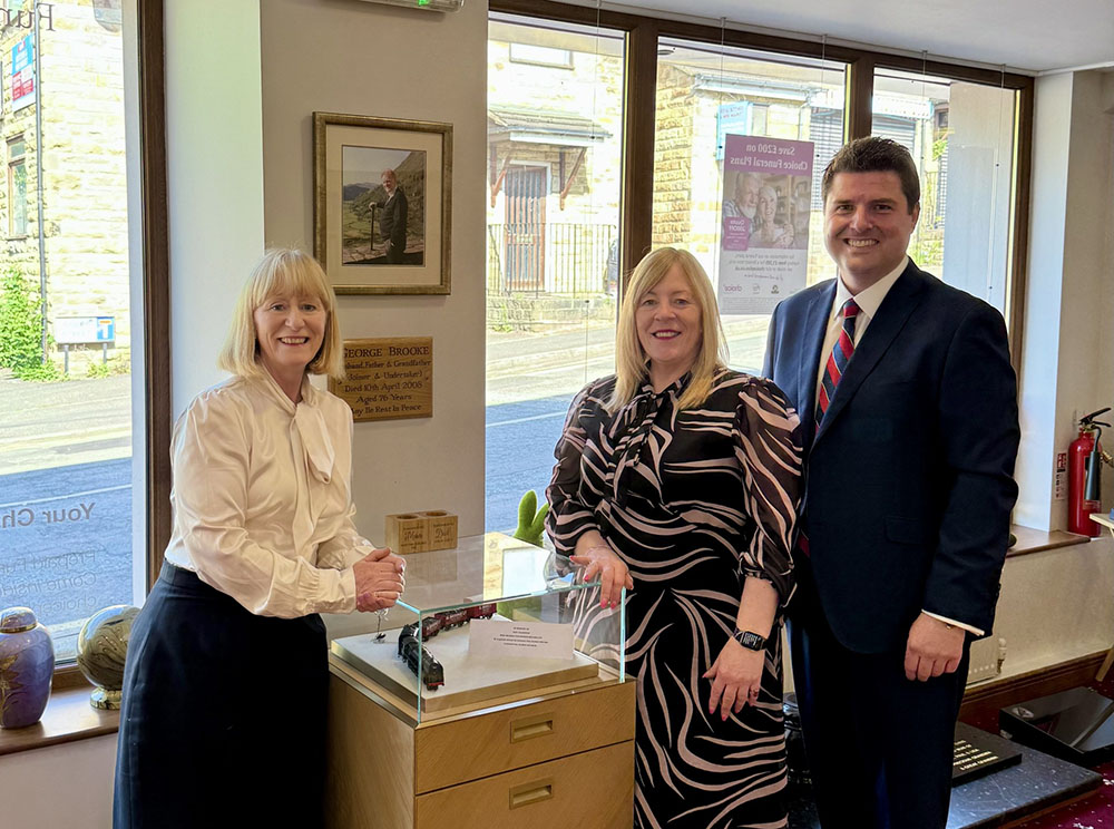 Chris Sykes, former funeral home work experience student, with Helen Wilson and Judith Brooke